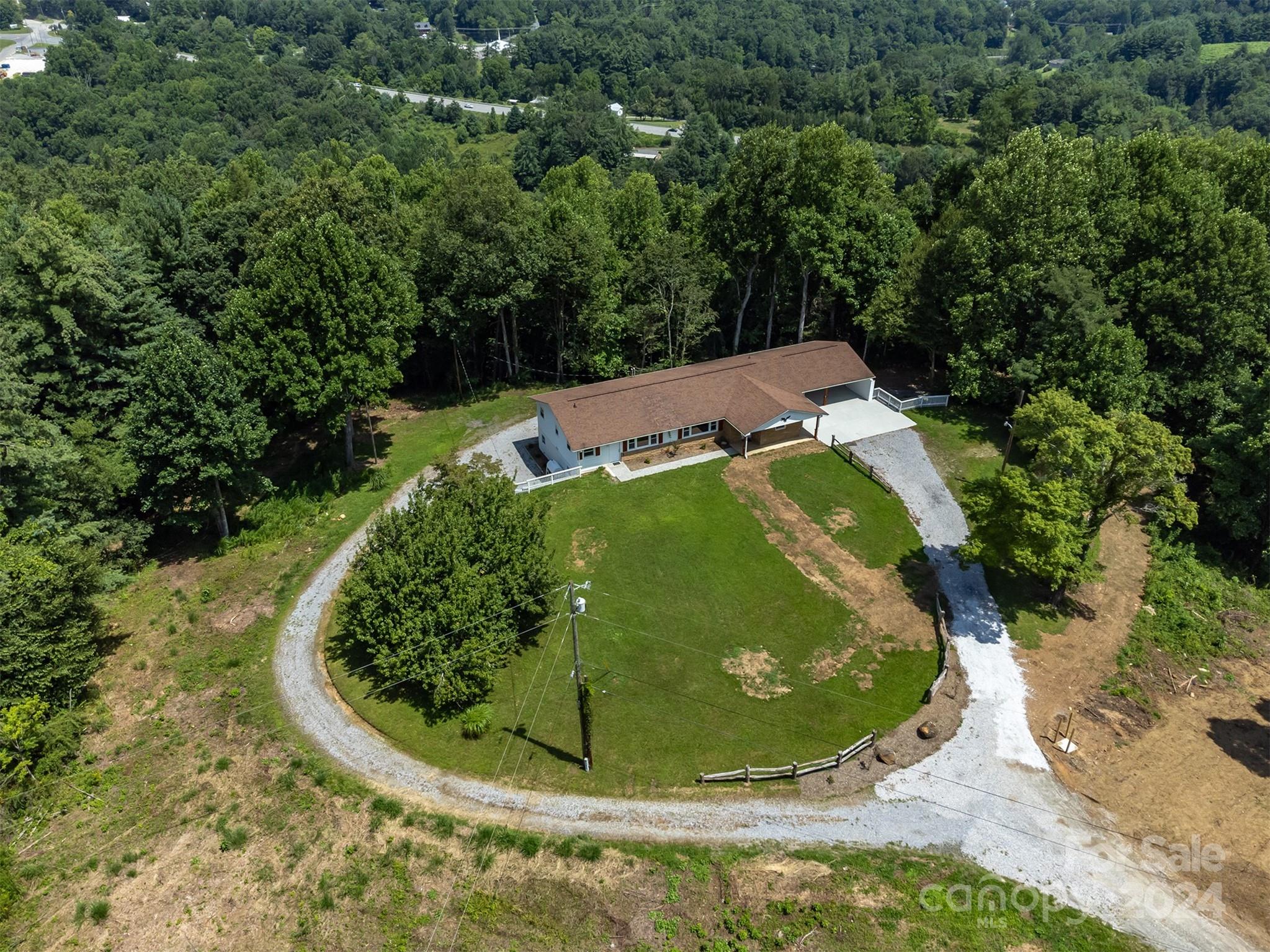 468 Deer Park Lake Road Spruce Pine, NC 28777 - Photo 4 of 46 a view of a garden