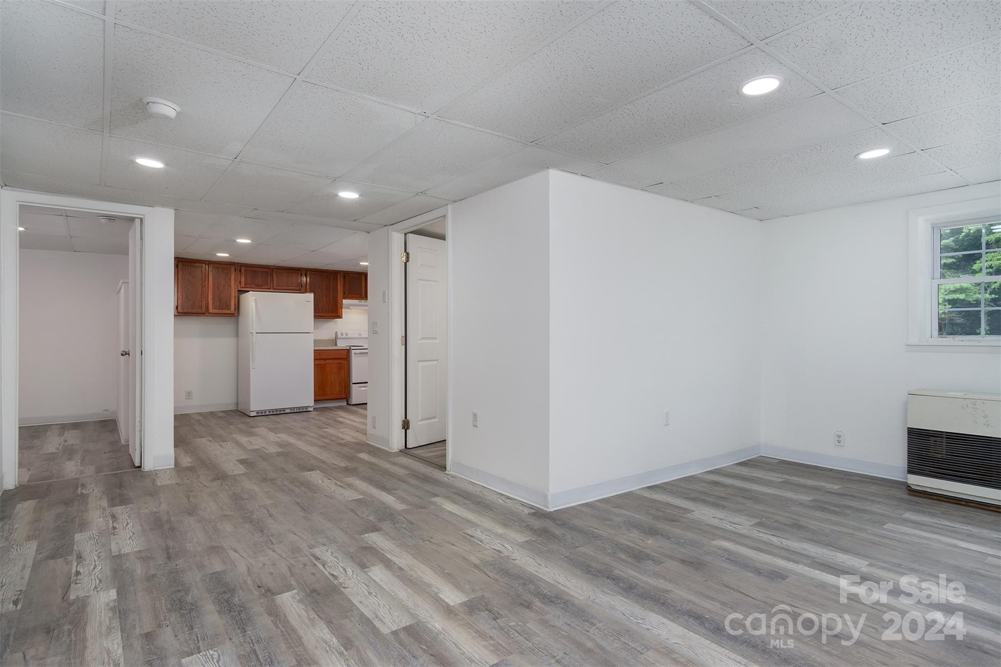468 Deer Park Lake Road Spruce Pine, NC 28777 - Photo 41 of 46 a view of empty room with wooden floor and window