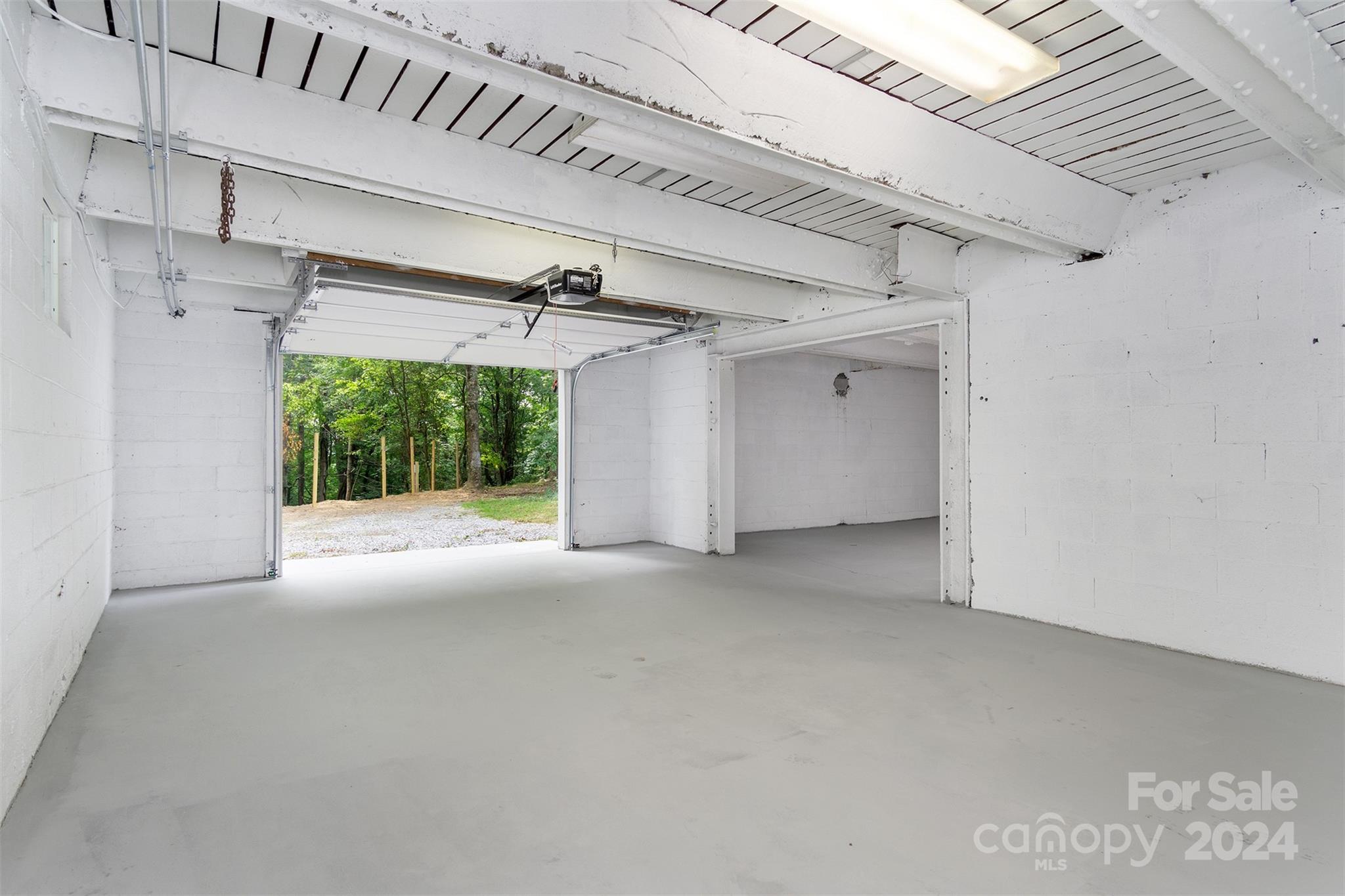 468 Deer Park Lake Road Spruce Pine, NC 28777 - Photo 44 of 46 a view of a livingroom with an empty space and a window