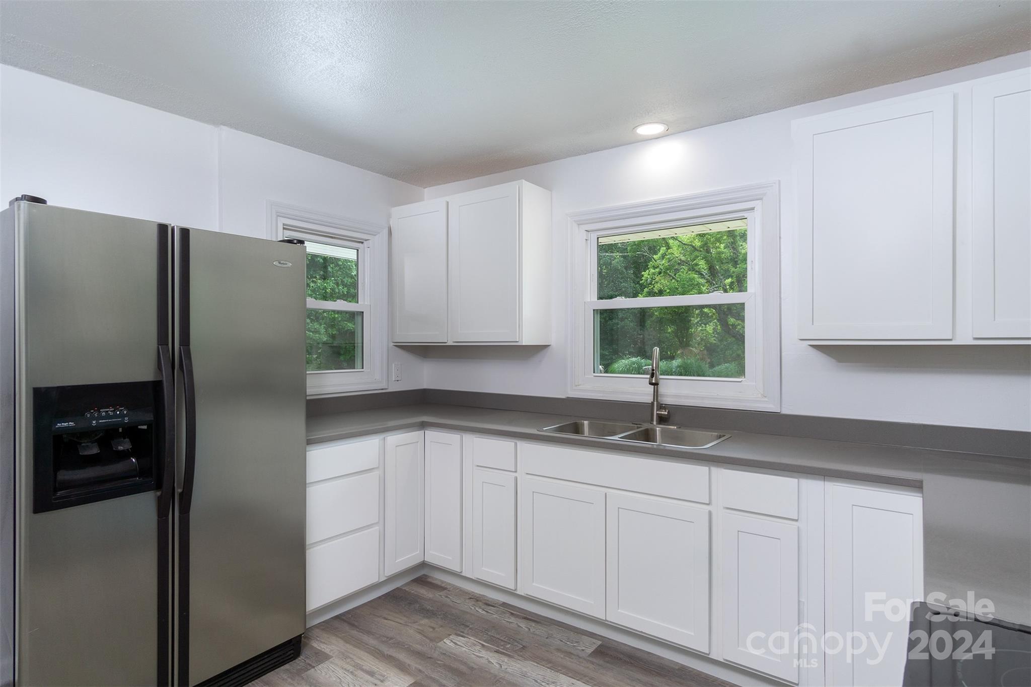 468 Deer Park Lake Road Spruce Pine, NC 28777 - Photo 5 of 46 a kitchen with a refrigerator and window