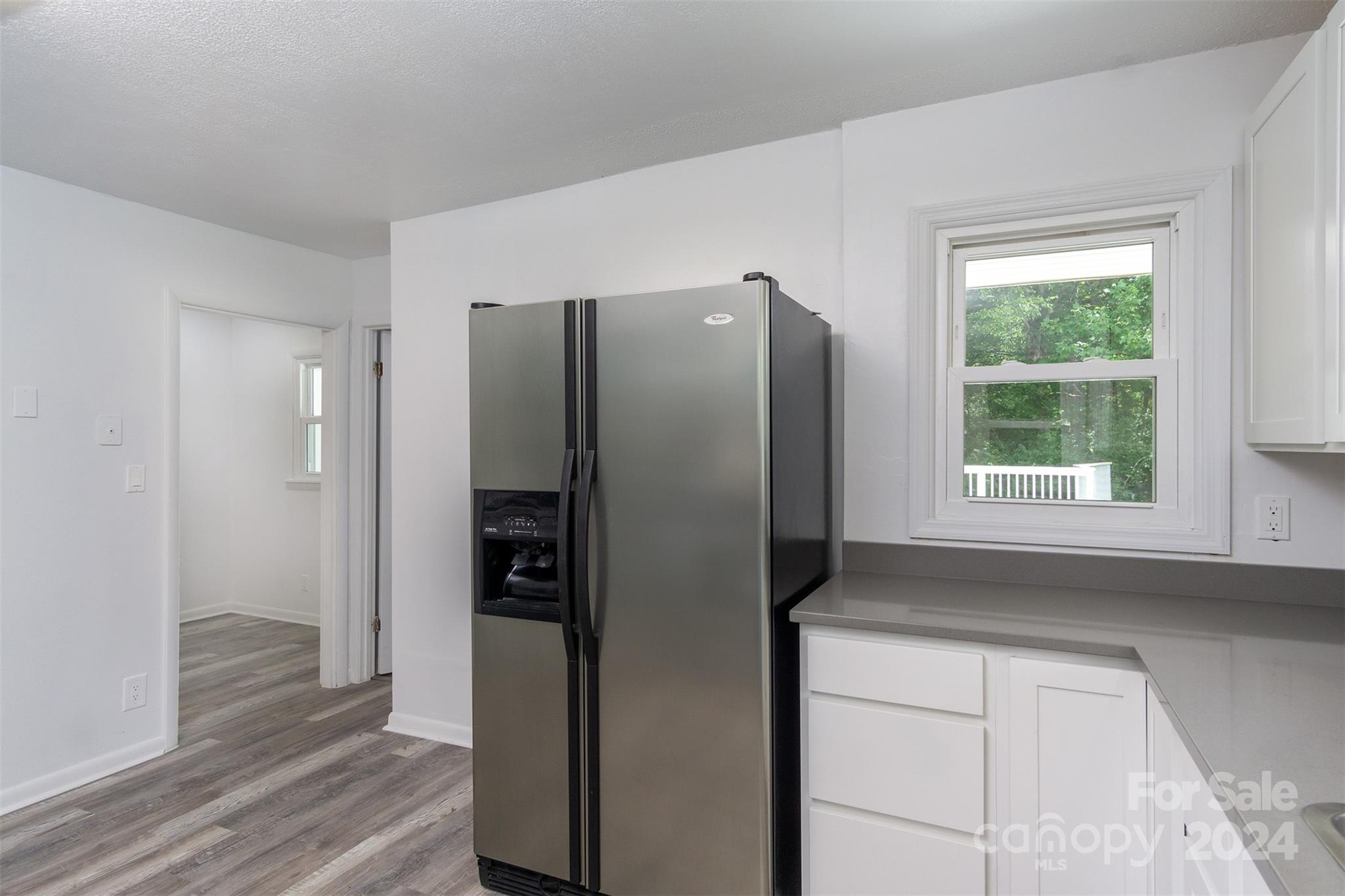 468 Deer Park Lake Road Spruce Pine, NC 28777 - Photo 6 of 46 a kitchen with stainless steel appliances a refrigerator and a window
