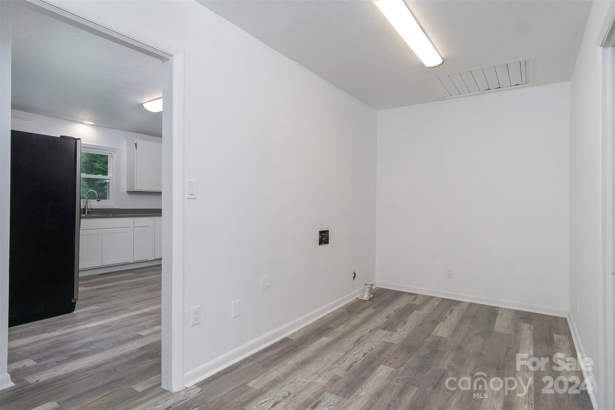 468 Deer Park Lake Road Spruce Pine, NC 28777 - Photo 8 of 46 a view of a hallway with wooden floor