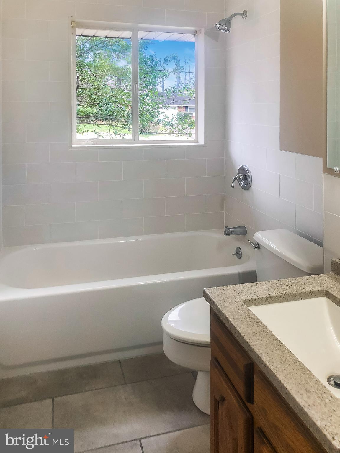 7202 Catlett Street Springfield, VA 22151 - Photo 14 of 28 a bathroom with a sink a toilet and a bathtub