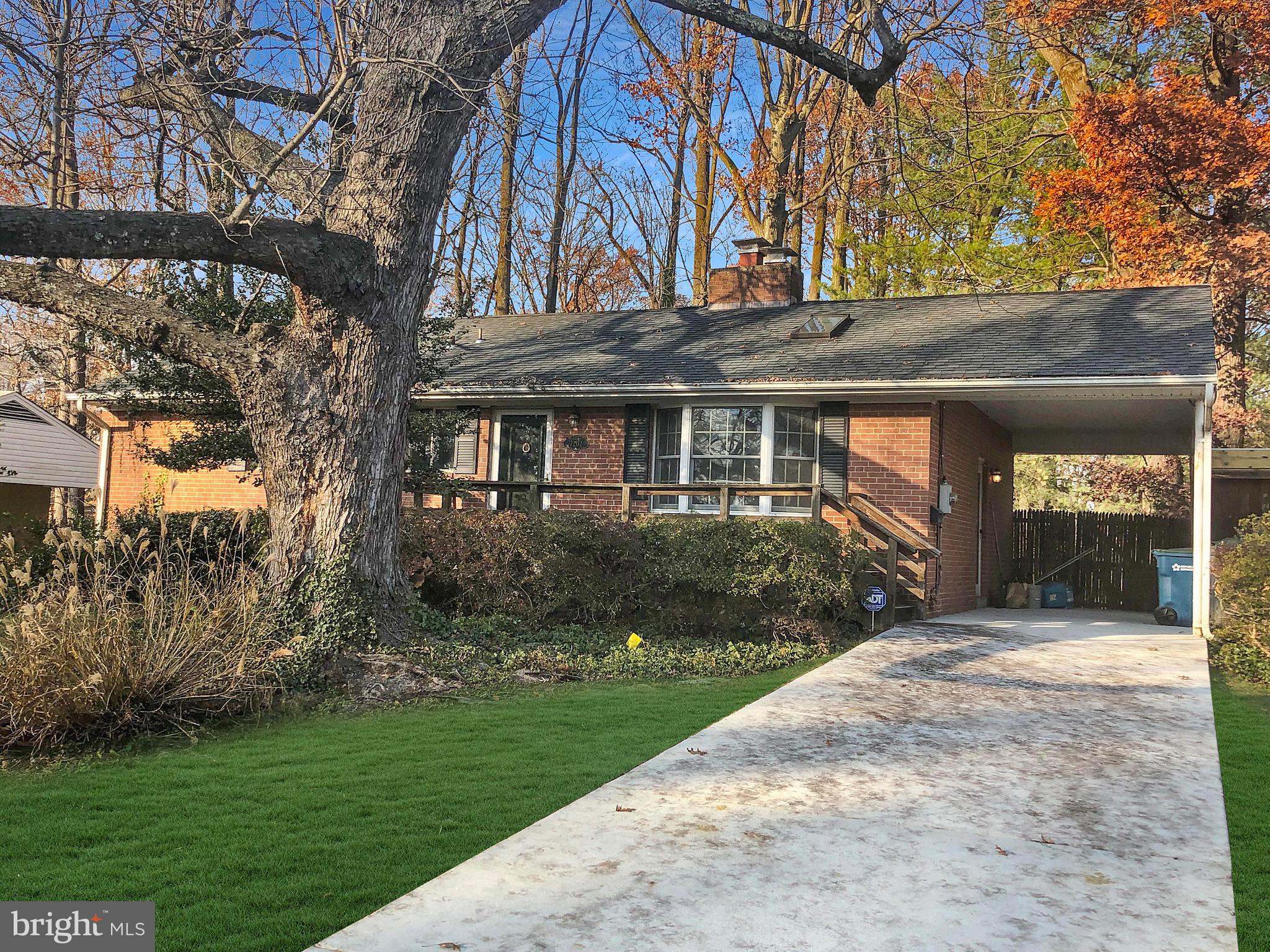 7202 Catlett Street Springfield, VA 22151 - Photo 3 of 28 a front view of a house with a garden and yard