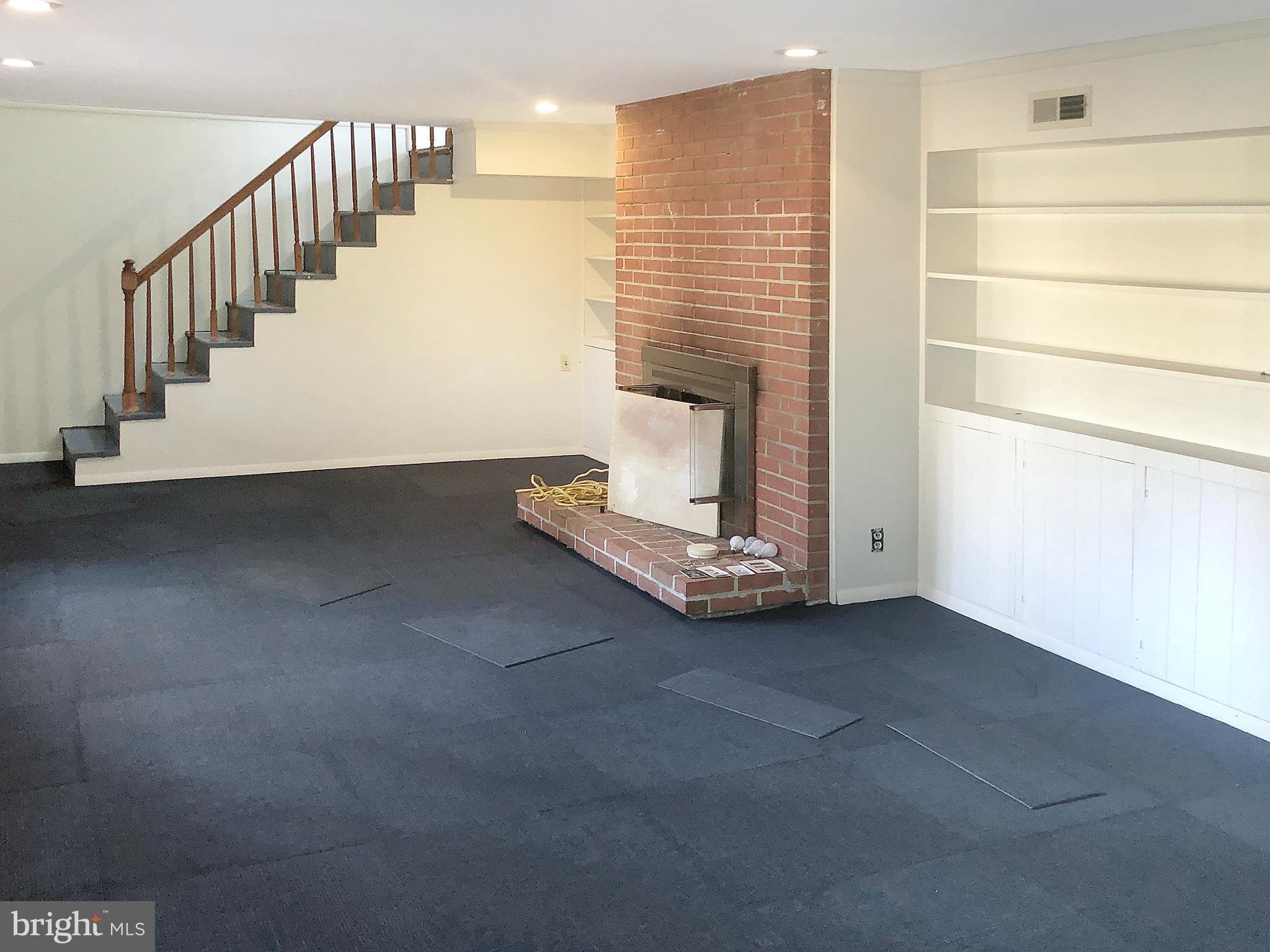 7202 Catlett Street Springfield, VA 22151 - Photo 23 of 28 a view of an empty room with stairs