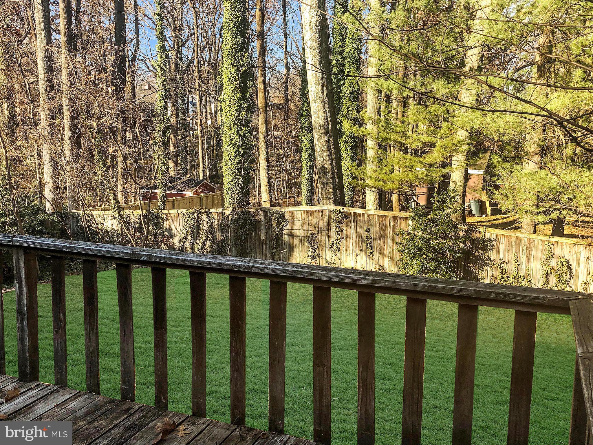 7202 Catlett Street Springfield, VA 22151 - Photo 5 of 28 a view of a balcony with wooden fence and floor