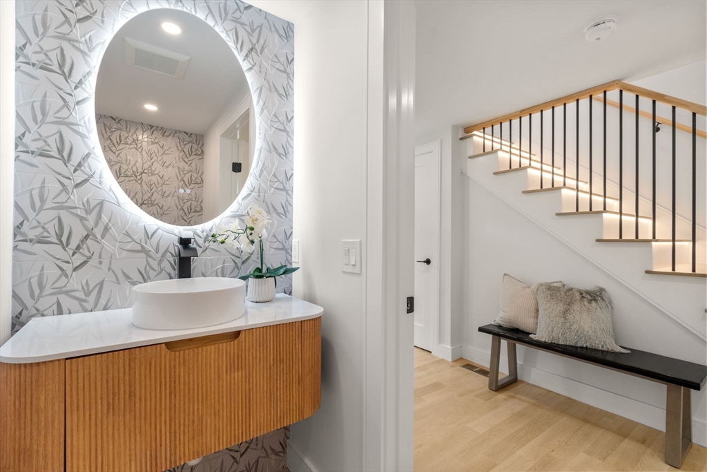 32 Deerfield Road Sharon, MA 02067 - Photo 11 of 32 a bathroom with a sink and a mirror