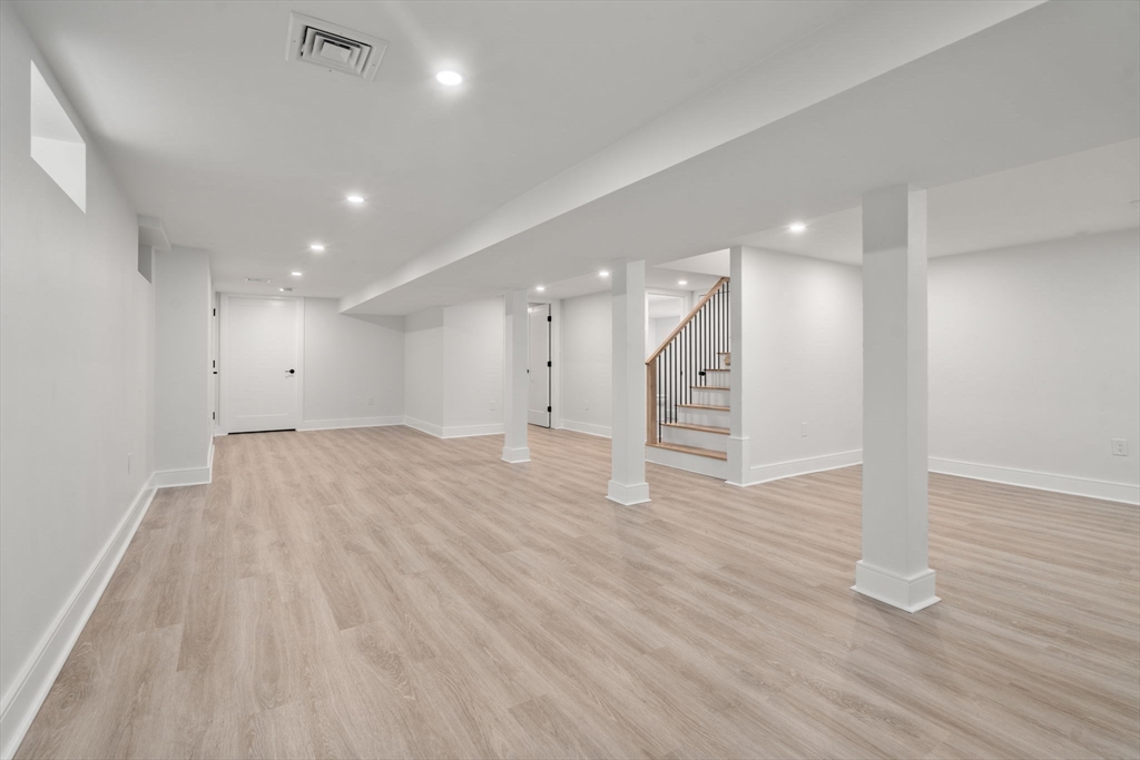 32 Deerfield Road Sharon, MA 02067 - Photo 25 of 32 a view of an empty room with wooden floor