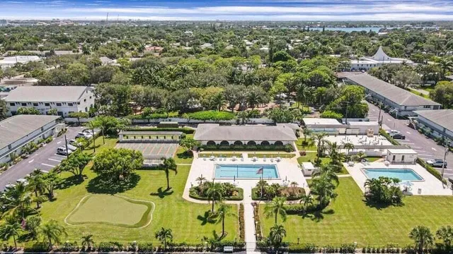 an aerial view of residential houses with outdoor space
