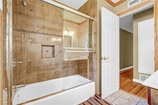 a bathroom with a bathtub and shower