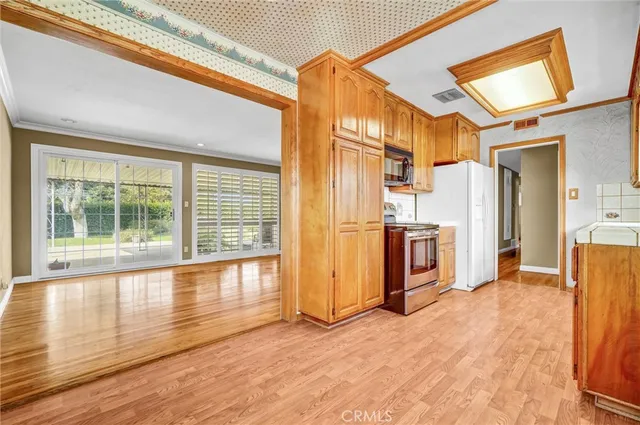 a view of front door and wooden floor