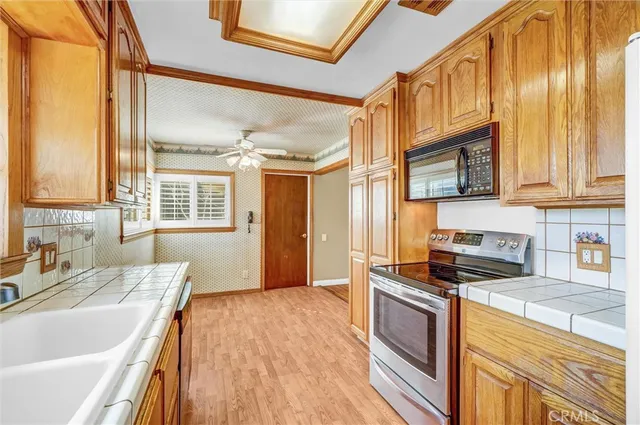 a kitchen with stainless steel appliances granite countertop a stove and a sink