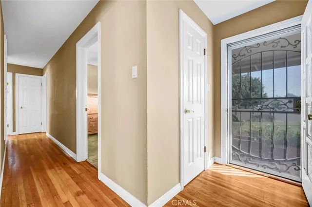 a view of a bathroom from a hallway