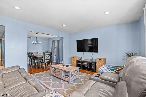 a kitchen with stainless steel appliances granite countertop a refrigerator sink and stove