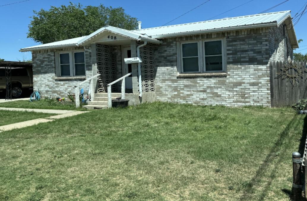 Dumas Sfh Bundle Dumas, TX 79029 - Photo 6 of 9 a front view of a house with a yard