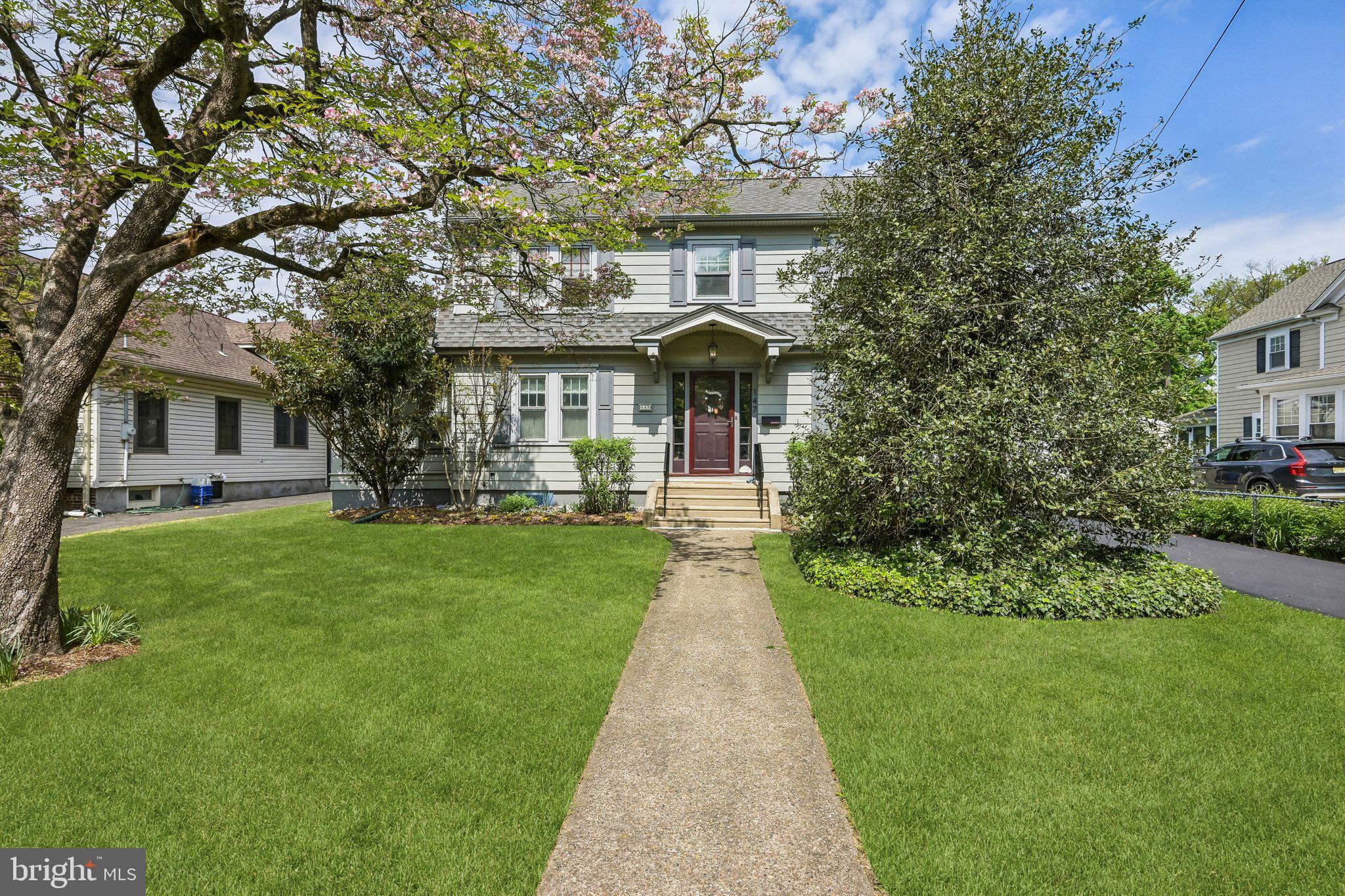 Charming home with lush greenery.
