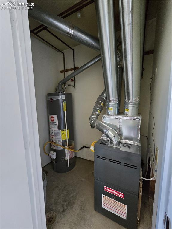12350 Holtwood Road Simla, CO 80835 - Photo 18 of 34 a room with water heater and utility racks