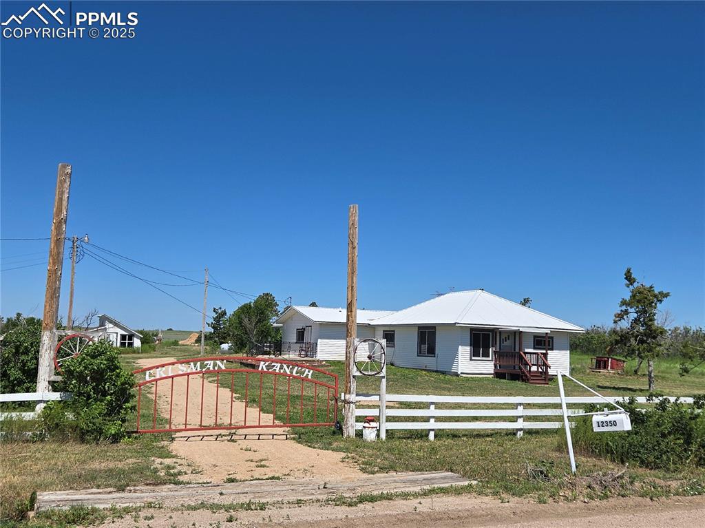 12350 Holtwood Road Simla, CO 80835 - Photo 2 of 34 a table and chairs in front of a yard