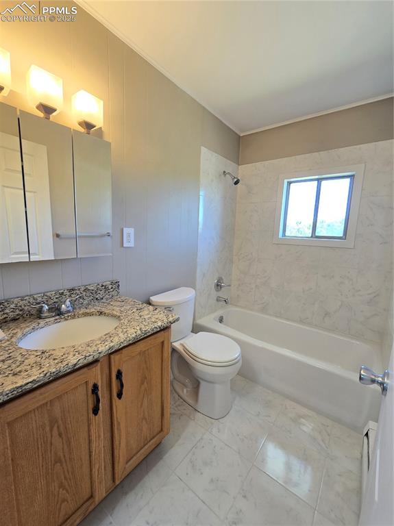 12350 Holtwood Road Simla, CO 80835 - Photo 25 of 34 a bathroom with a granite countertop sink a toilet and bathtub