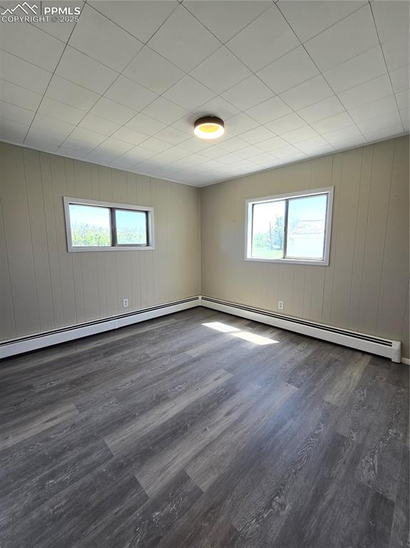 12350 Holtwood Road Simla, CO 80835 - Photo 26 of 34 an empty room with wooden floor and windows
