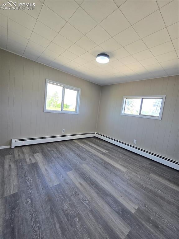 12350 Holtwood Road Simla, CO 80835 - Photo 27 of 34 an empty room with wooden floor and windows