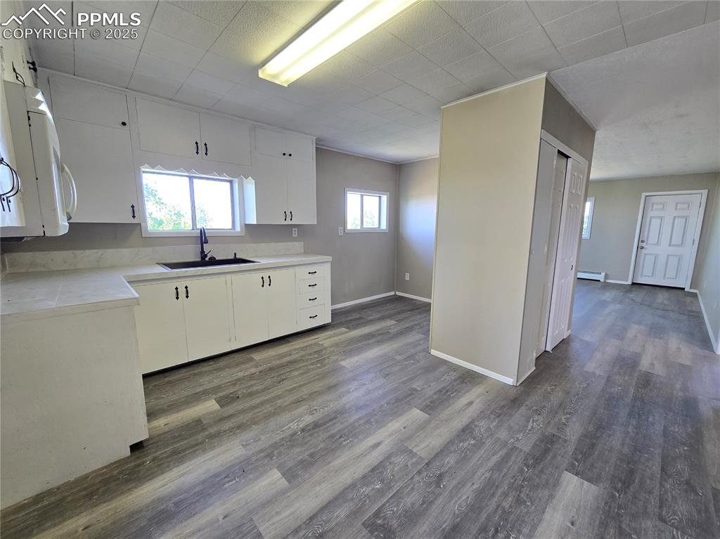 12350 Holtwood Road Simla, CO 80835 - Photo 30 of 34 a large kitchen with a lot of counter space and wooden floor