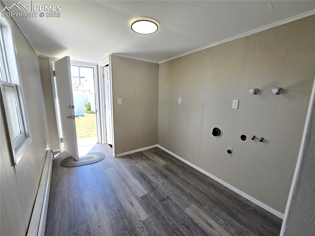 12350 Holtwood Road Simla, CO 80835 - Photo 31 of 34 a view of an empty room with wooden floor and a window