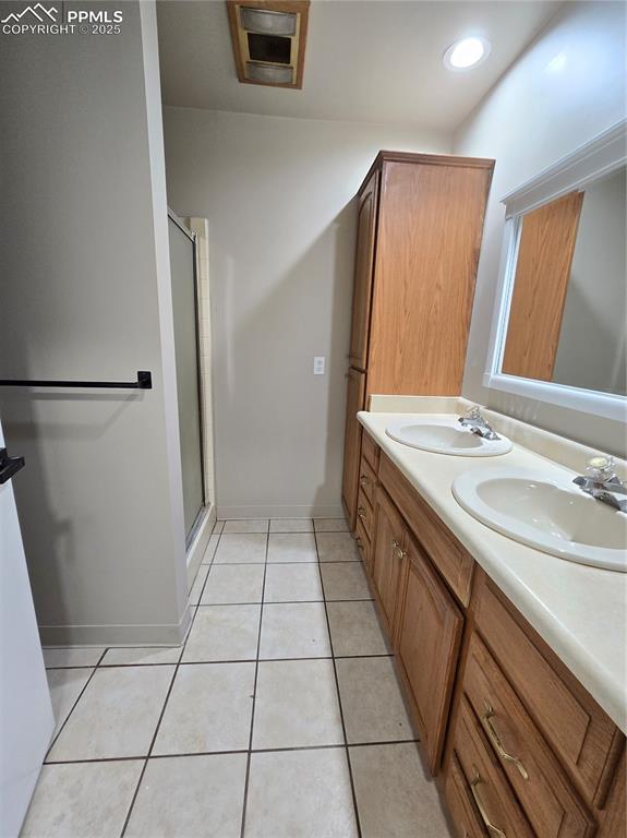 12350 Holtwood Road Simla, CO 80835 - Photo 8 of 34 a bathroom with a sink a mirror and a shower