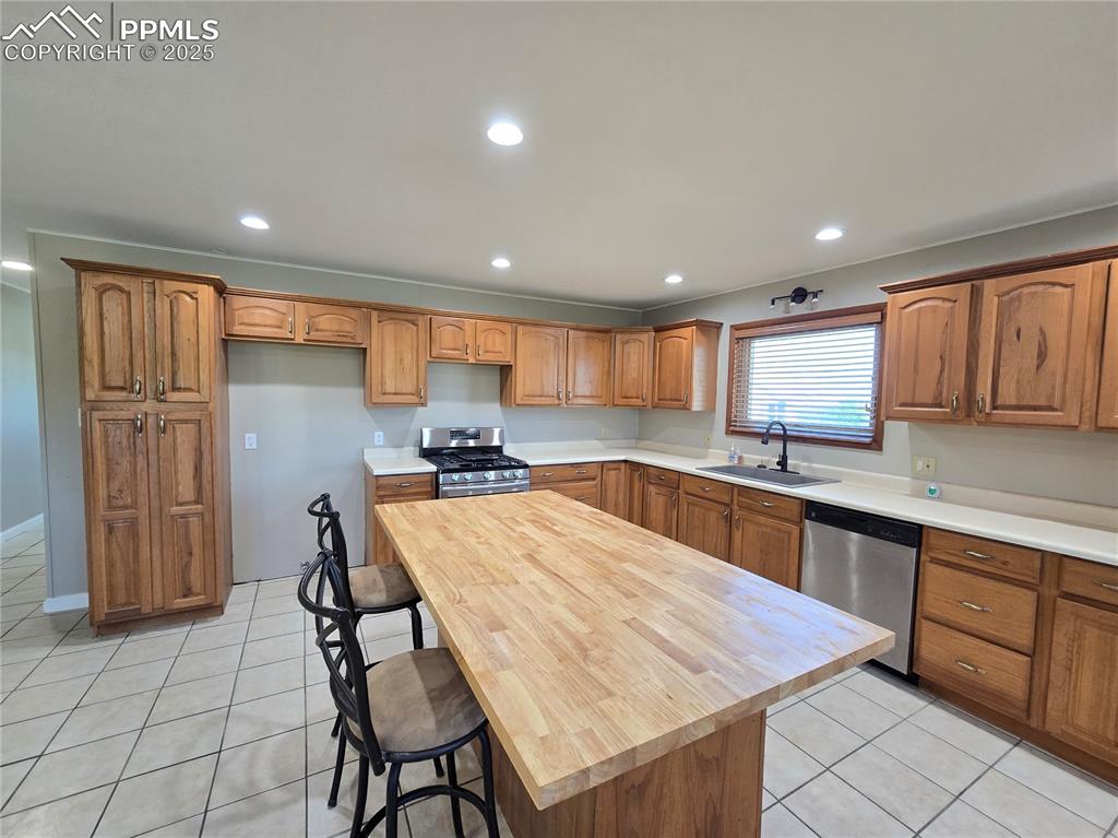 12350 Holtwood Road Simla, CO 80835 - Photo 10 of 34 a large kitchen with lots of counter space wooden cabinets and appliances