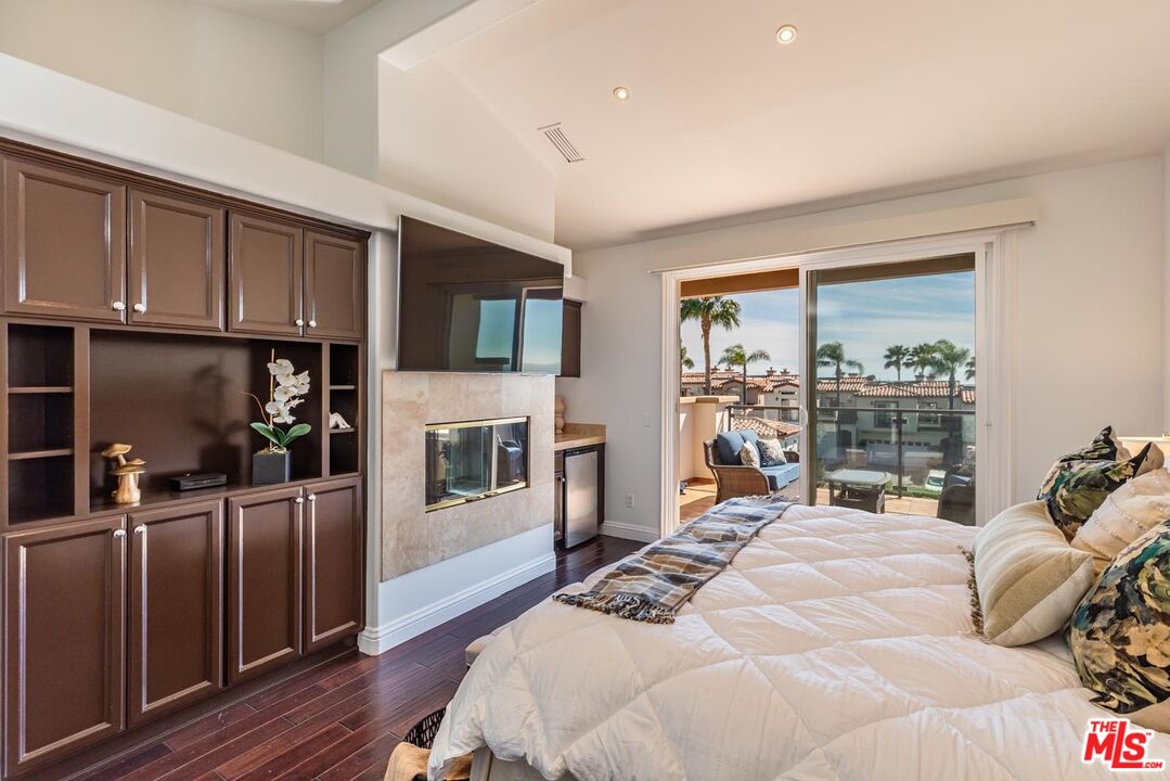 6438 Lunita Road Malibu, CA 90265 - Photo 13 of 34 a bed room with a bed and a television