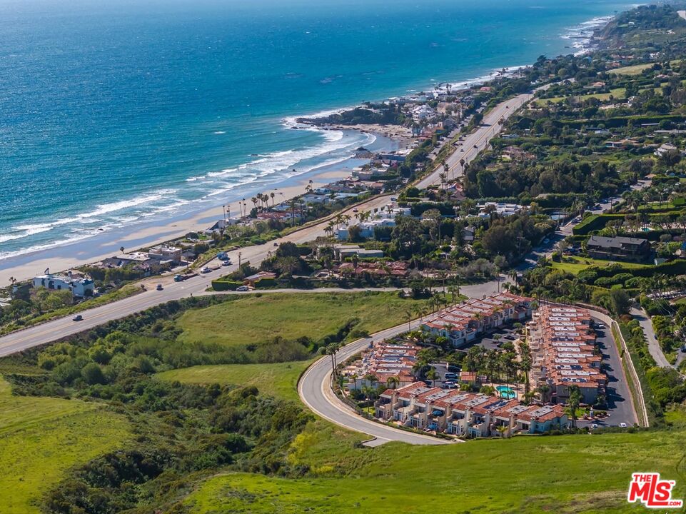 6438 Lunita Road Malibu, CA 90265 - Photo 17 of 34 a view of a lake with a yard