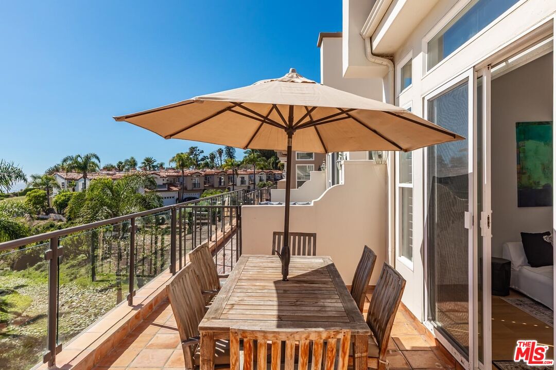 6438 Lunita Road Malibu, CA 90265 - Photo 26 of 34 a view of balcony with wooden floor and outdoor seating