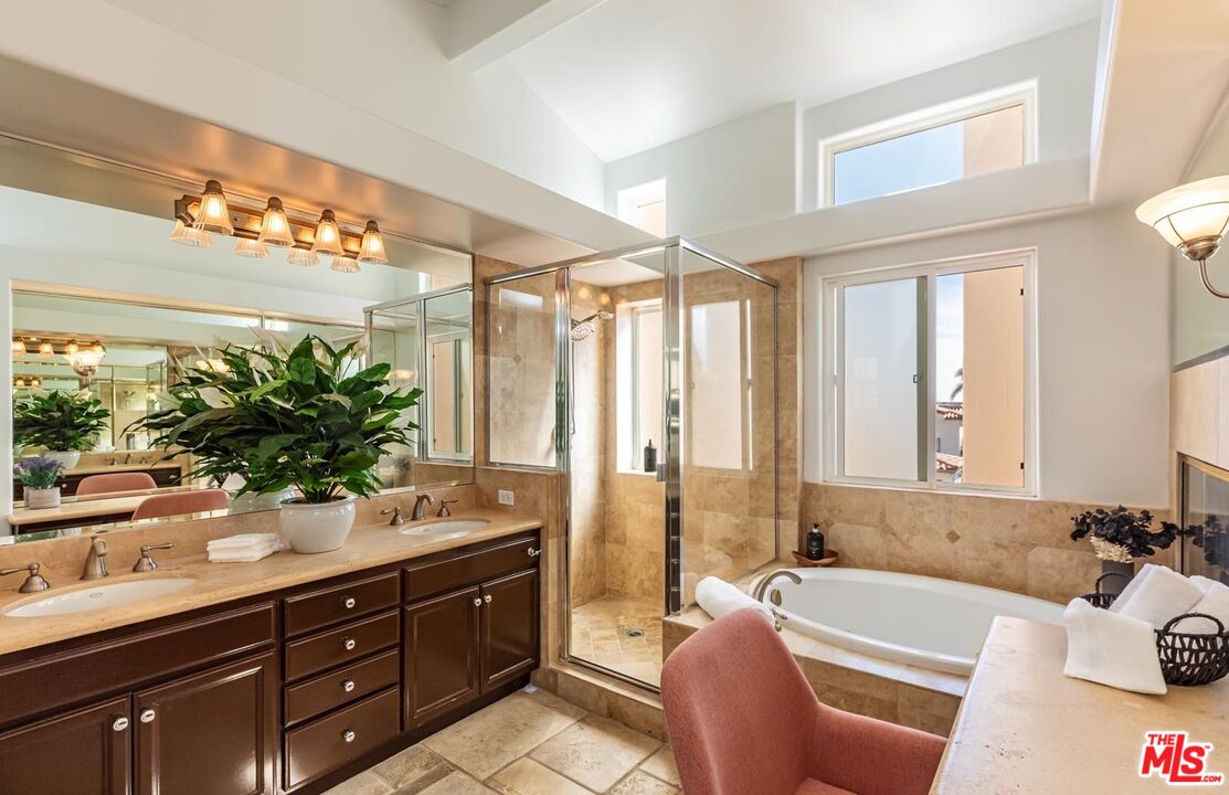 6438 Lunita Road Malibu, CA 90265 - Photo 27 of 34 a bathroom with a tub mirror and sink
