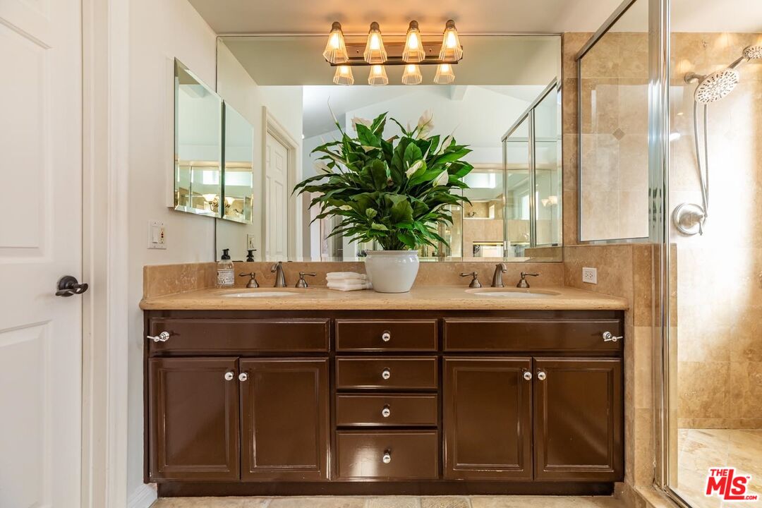 6438 Lunita Road Malibu, CA 90265 - Photo 29 of 34 a bathroom with a sink and a mirror