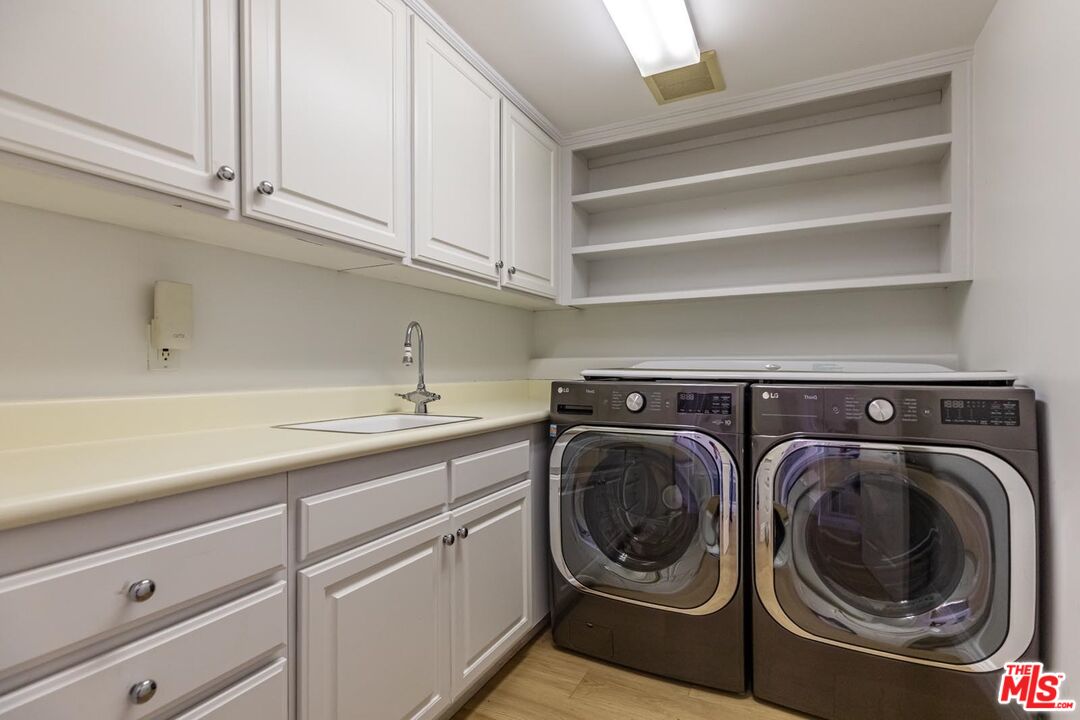 6438 Lunita Road Malibu, CA 90265 - Photo 33 of 34 a utility room with sink dryer and washer