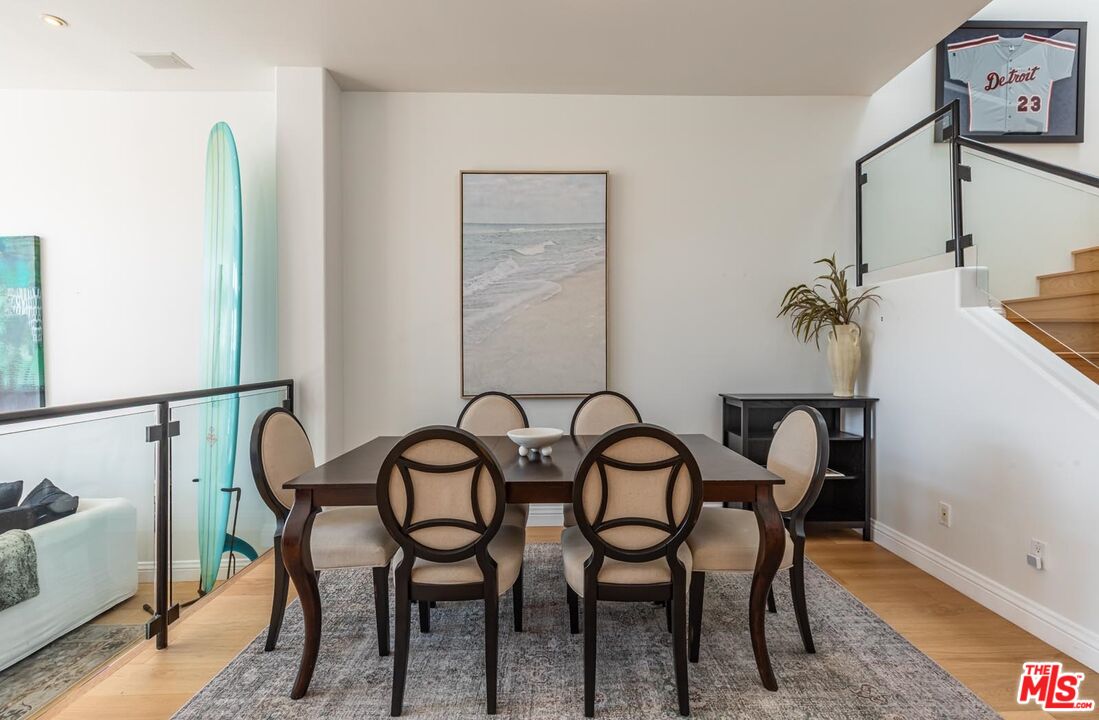 6438 Lunita Road Malibu, CA 90265 - Photo 9 of 34 a view of a dining room with furniture and wooden floor