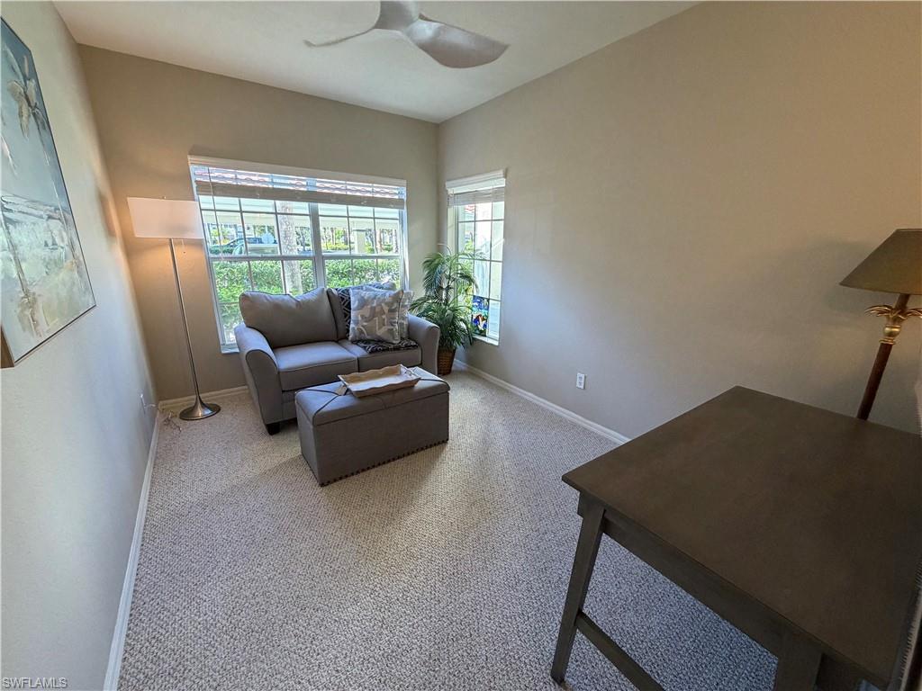 23810 Marbella Bay Road, Unit 102 Estero, FL 34135 - Photo 15 of 26 a living room with furniture and a window