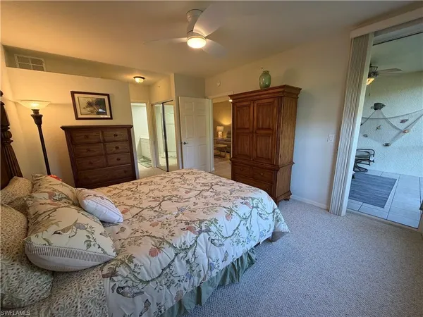 a bedroom with a bed and a walk in closet