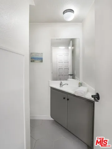 a bathroom with a sink and mirror