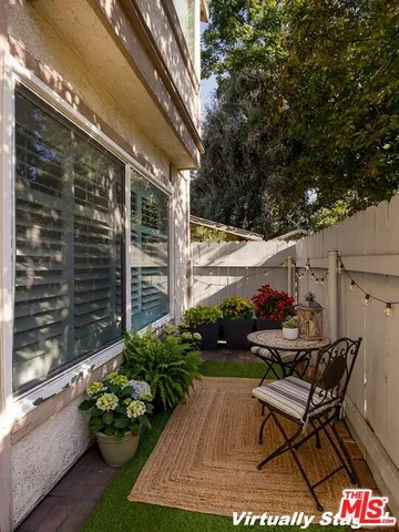 a backyard of a house with seating space