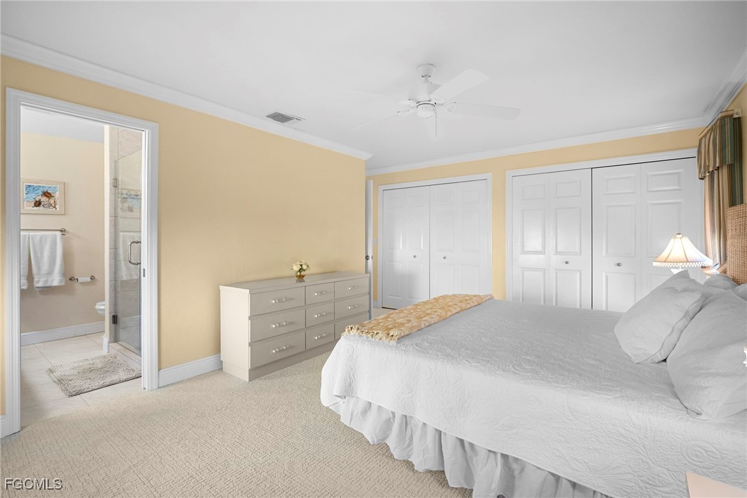5688 Arvine Circle Fort Myers, FL 33919 - Photo 11 of 39 a bedroom with a bed and a walk in closet