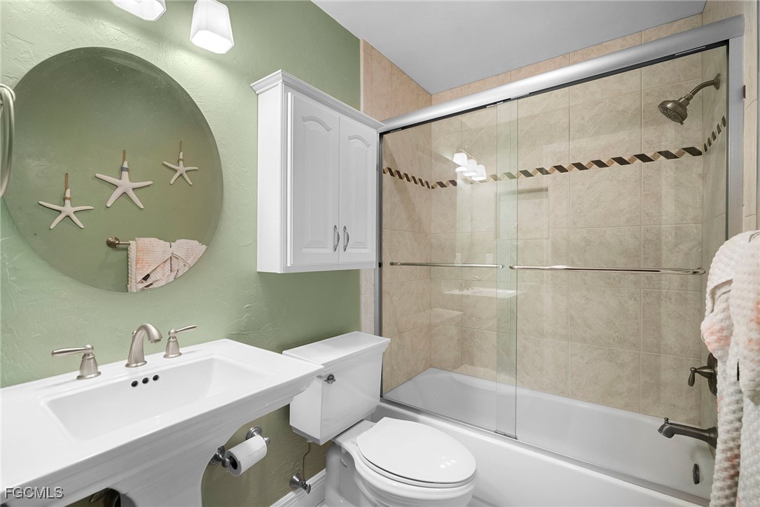 5688 Arvine Circle Fort Myers, FL 33919 - Photo 16 of 39 a bathroom with a sink toilet tub and shower