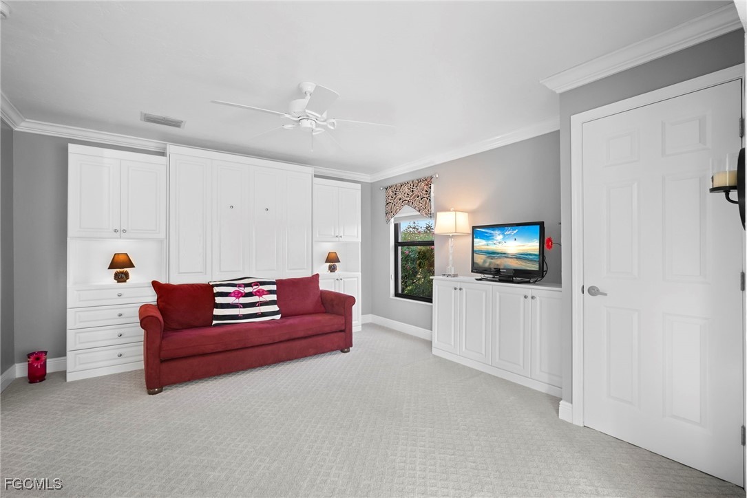 5688 Arvine Circle Fort Myers, FL 33919 - Photo 20 of 39 a living room with furniture and a flat screen tv