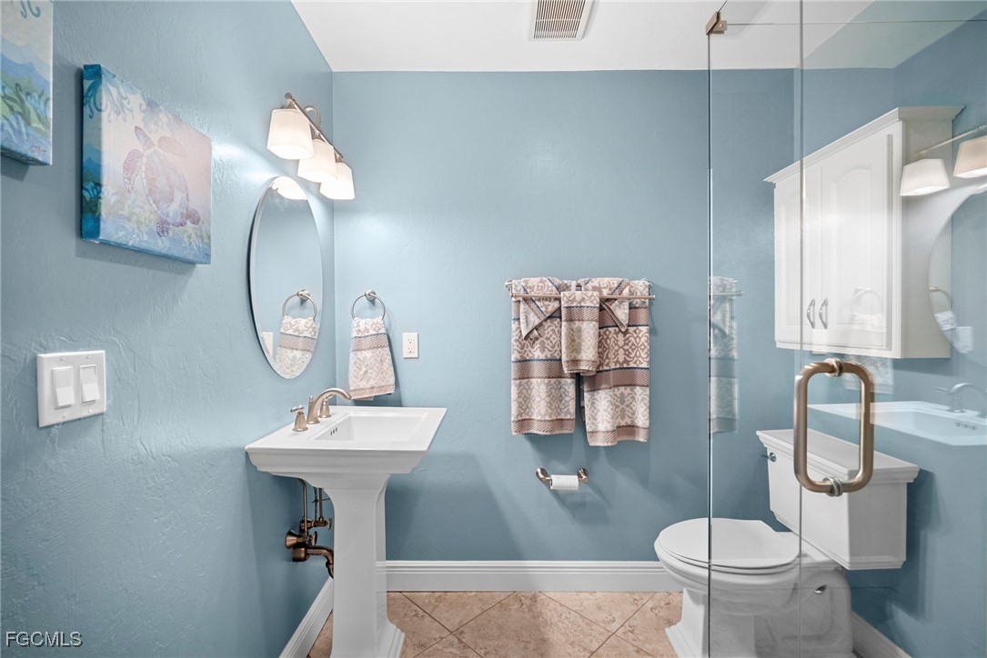 5688 Arvine Circle Fort Myers, FL 33919 - Photo 25 of 39 a bathroom with a sink toilet and a mirror