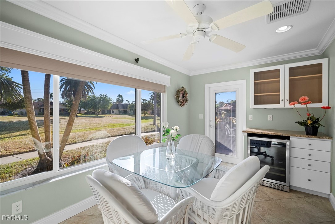 5688 Arvine Circle Fort Myers, FL 33919 - Photo 30 of 39 a view of a dining room with furniture large windows and wooden floor