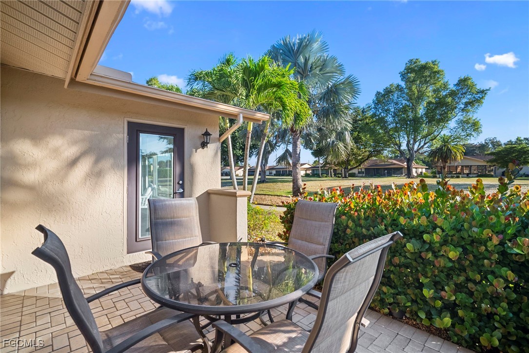 5688 Arvine Circle Fort Myers, FL 33919 - Photo 33 of 39 a view of outdoor dining space with a table and chairs