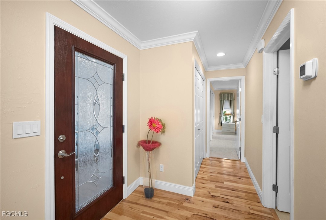 5688 Arvine Circle Fort Myers, FL 33919 - Photo 34 of 39 a view of a hallway with wooden floor and closet