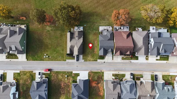 an aerial view of a building with outdoor space