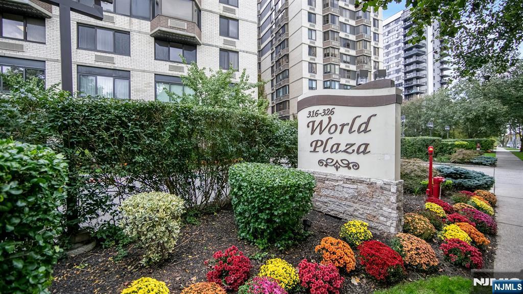 a sign that is in front of flowers