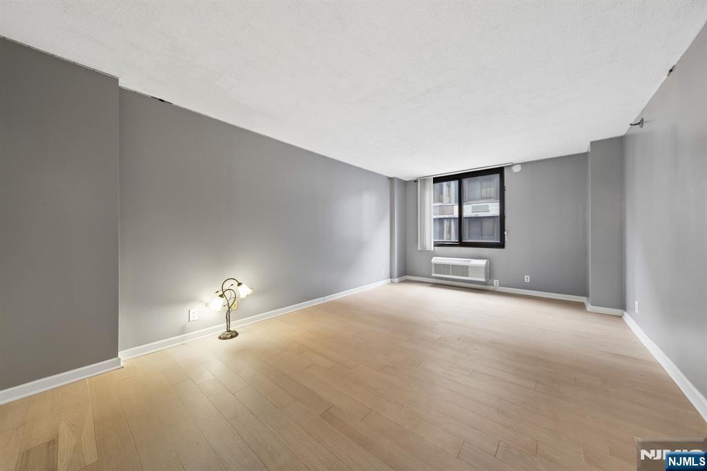 326 Prospect Avenue, Unit 10H Hackensack, NJ 07601 - Photo 11 of 31 a view of empty room with a fireplace
